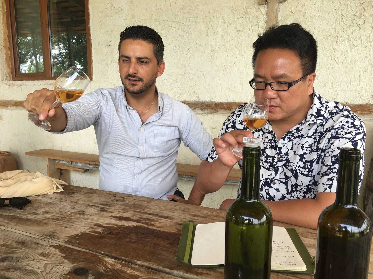 Expert wine selection, wine experts tasting Georgian Rkatsiteli orange wine